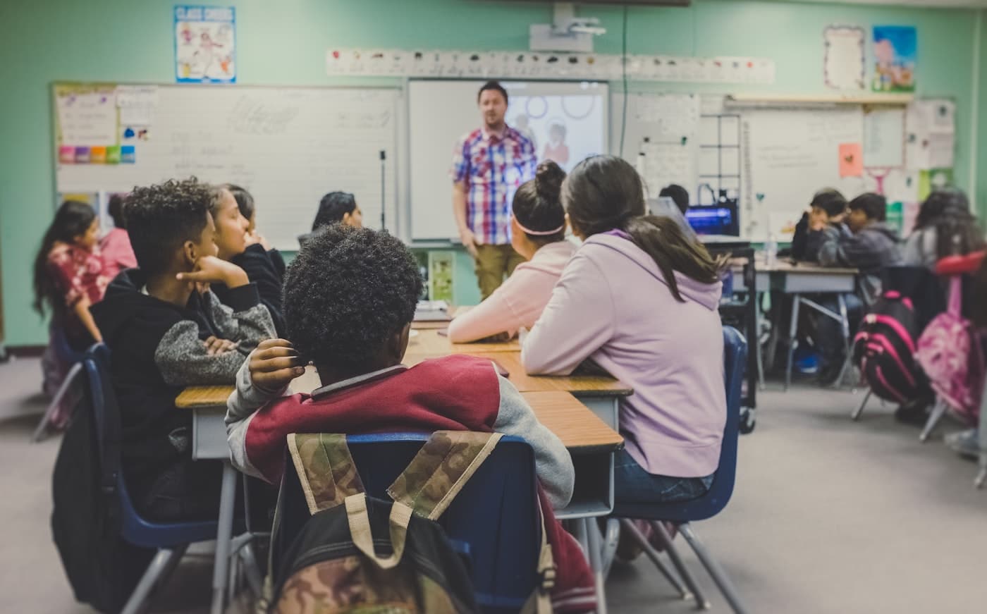 Students at desks in a classroom